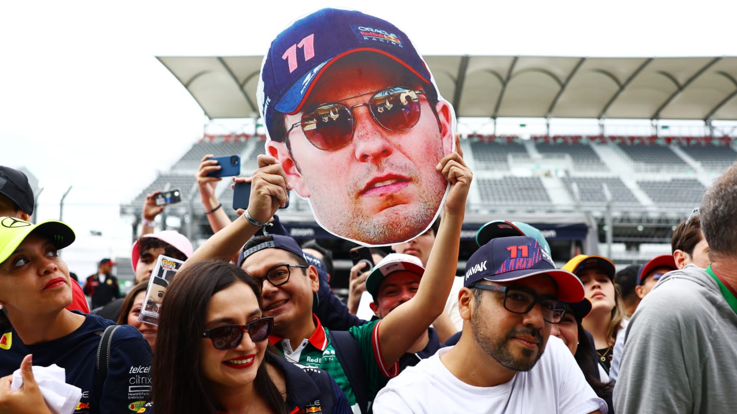 MEXICO CITY, MEXICO - OCTOBER 26: Sergio Perez of Mexico and Oracle Red Bull Racing fans show their