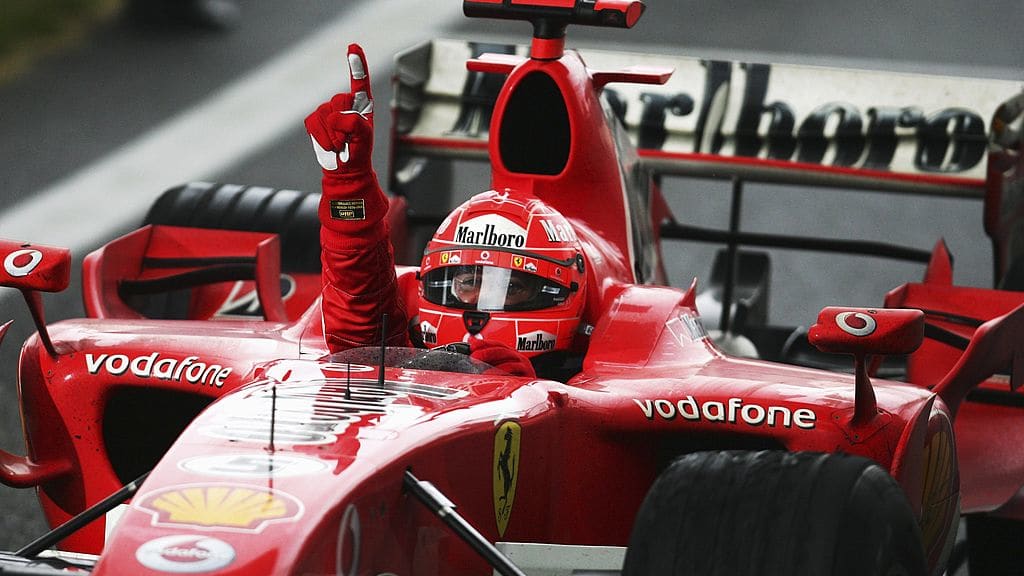 SHANGHAI, CHINA - OCTOBER 01:  Michael Schumacher of Germany and Ferrari celebrates winning the