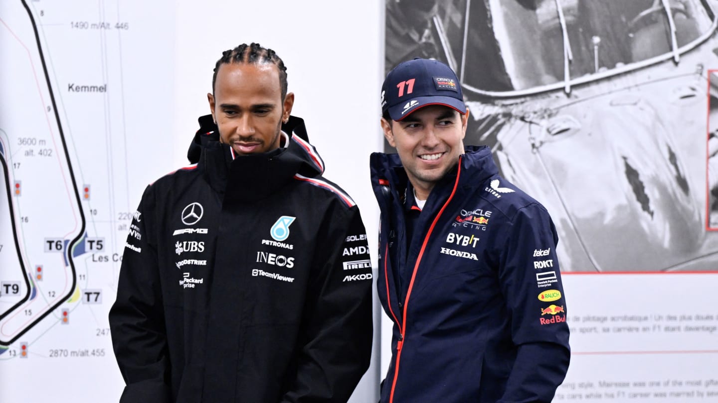 Mercedes' British driver Lewis Hamilton (L) and Red Bull Racing's Mexican driver Sergio Perez