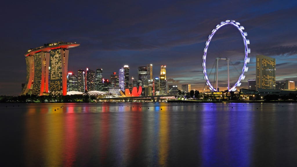 SINGAPORE, SINGAPORE - AUGUST 19: The Singapore Flyer is lit up to celebrate the launch of the