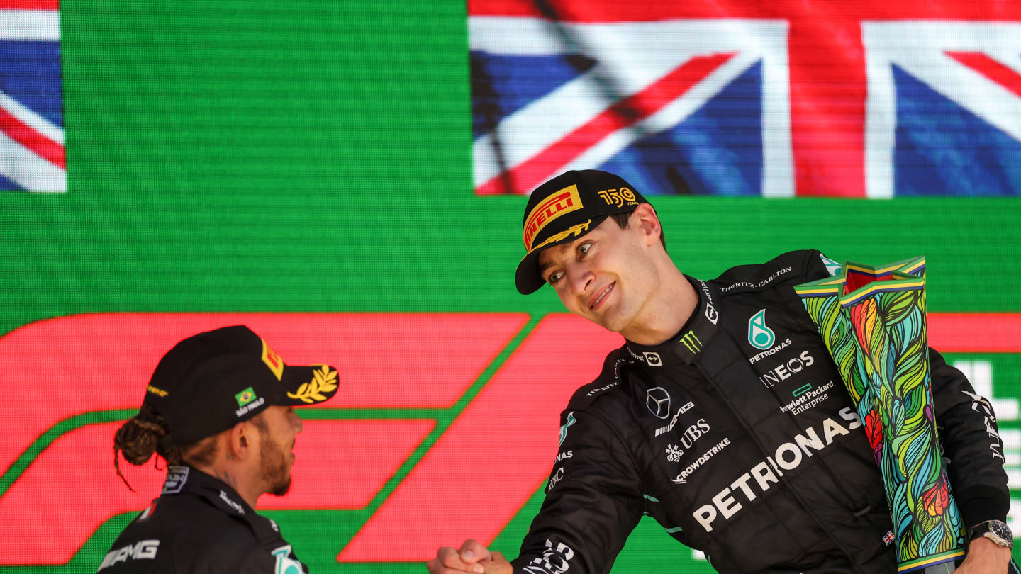 SAO PAULO, BRAZIL - NOVEMBER 13: Lewis Hamilton of Mercedes and Great Britain congratulates George