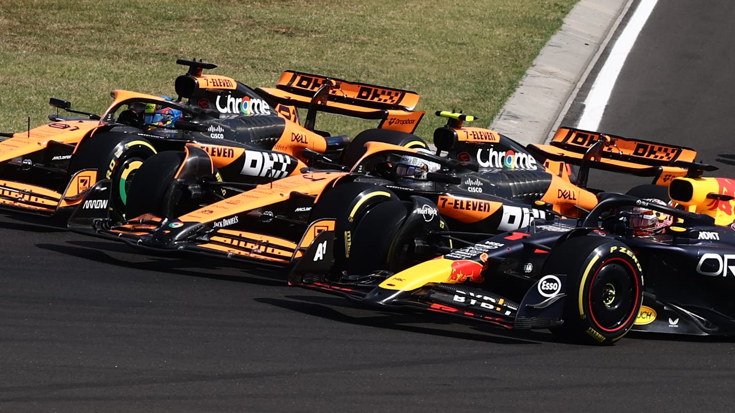 Max Verstappen of Red Bull Racing, Lando Norris and Oscar Piastri of McLaren at start of the