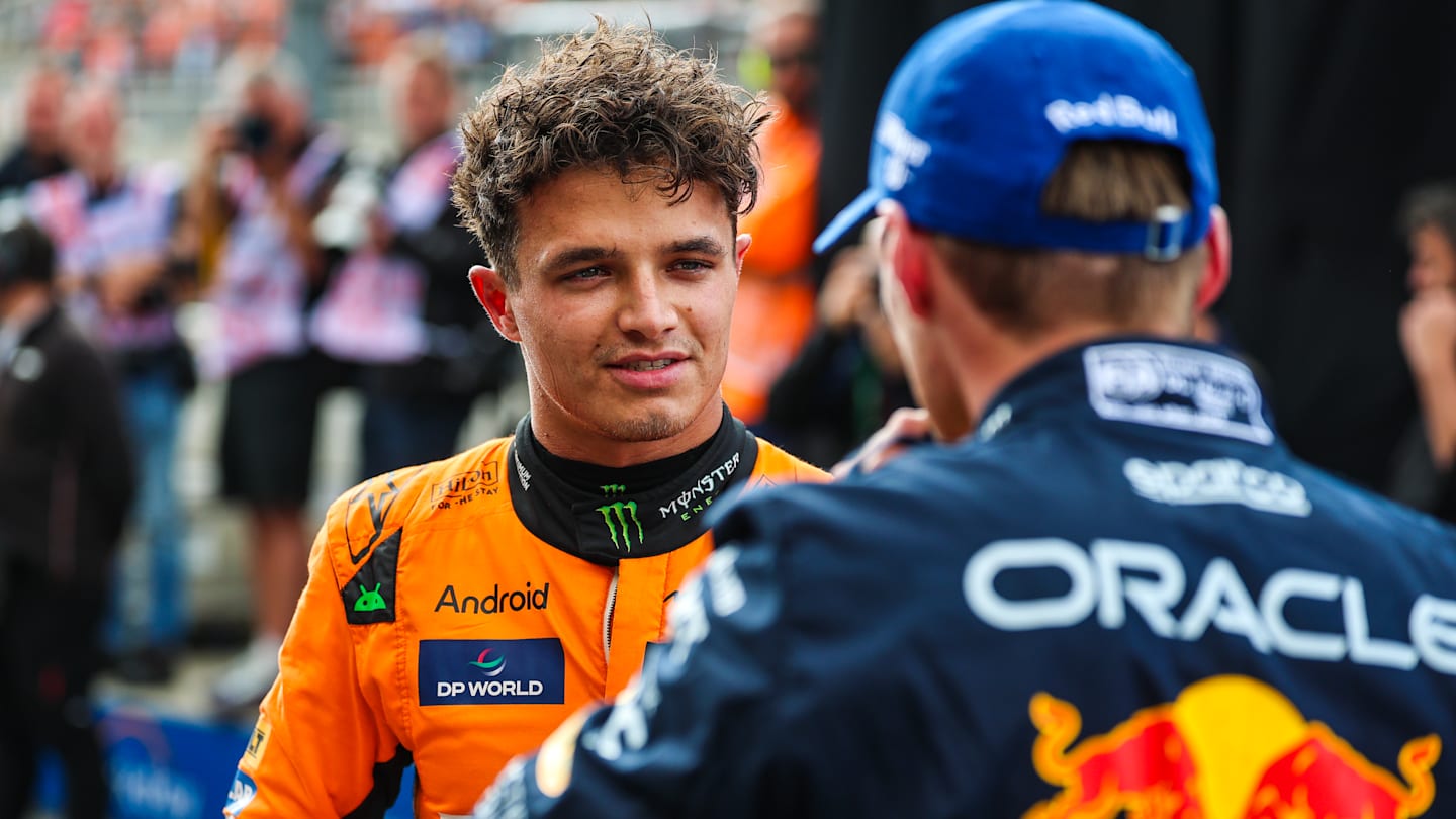 ZANDVOORT, NETHERLANDS - AUGUST 24: Lando Norris of Great Britain and McLaren and Max Verstappen of
