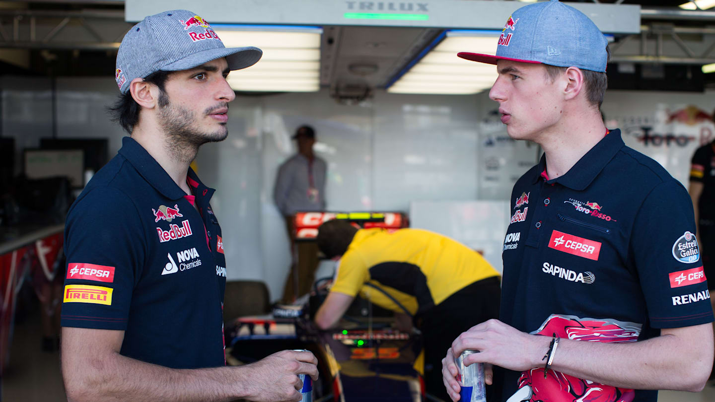 MELBOURNE, AUSTRALIA - MARCH 14:  Carlos Sainz of Spain and Max Verstappen of The Netherlands both
