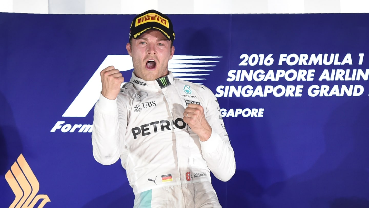 Mercedes AMG Petronas F1 Team's German driver Nico Rosberg punches the air on the podium as he