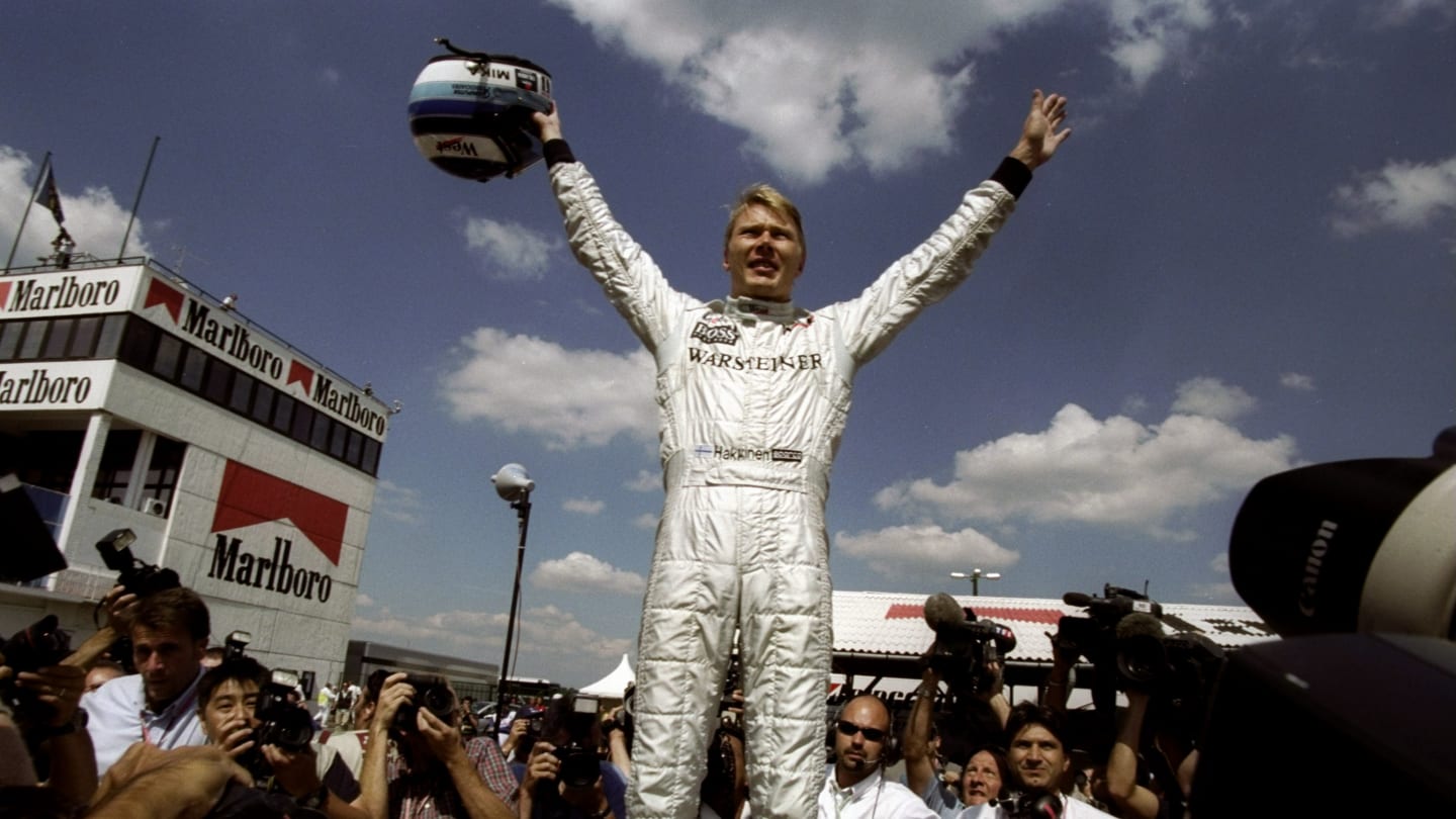 15 Aug 1999:  Mika Hakkinen of Finland and the McLaren-Mercedes team celebrates winning the