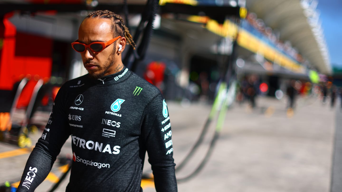 SAO PAULO, BRAZIL - NOVEMBER 04: Lewis Hamilton of Great Britain and Mercedes walks to the grid