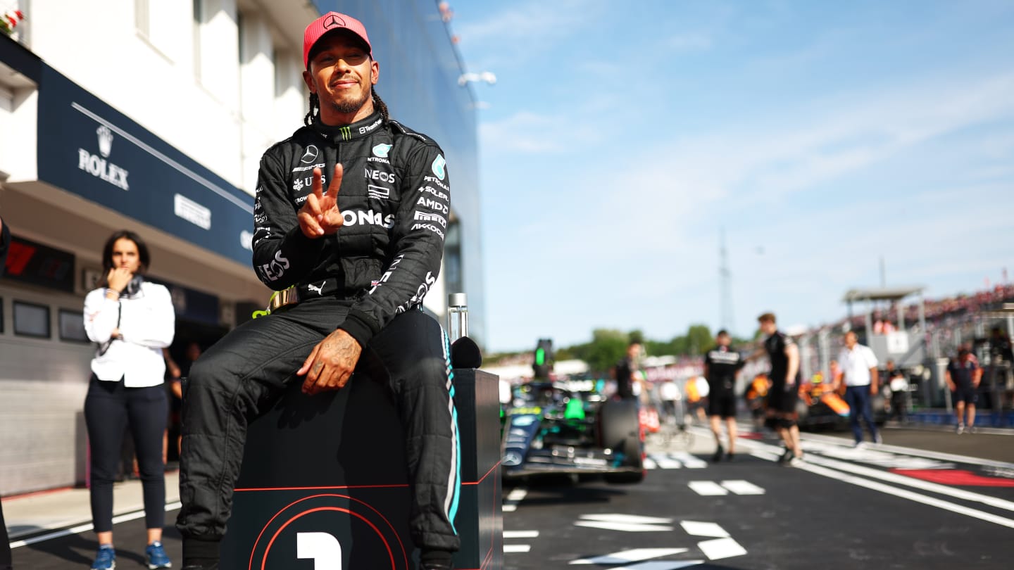 BUDAPEST, HUNGARY - JULY 22: Pole position qualifier Lewis Hamilton of Great Britain and Mercedes