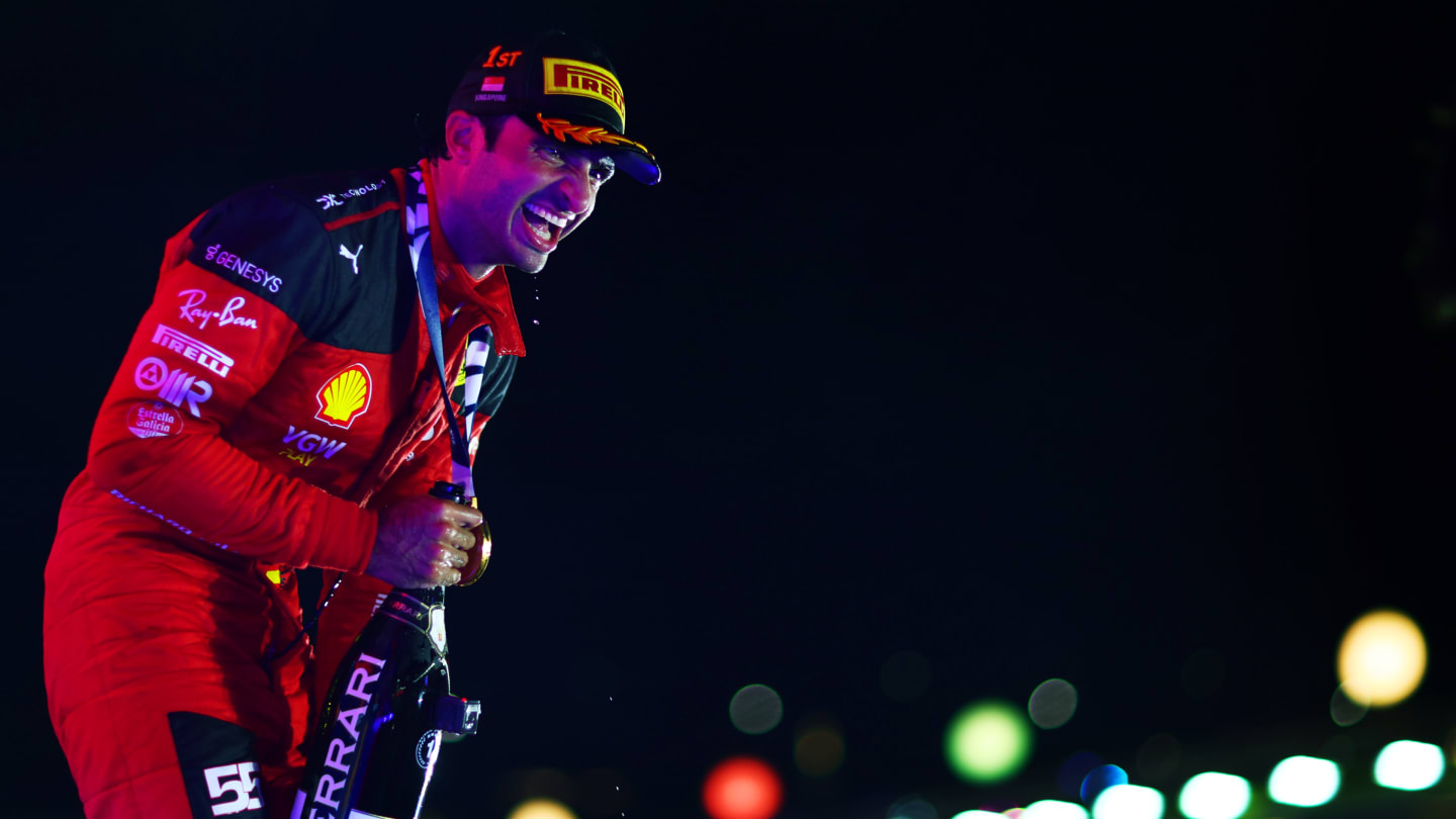 SINGAPORE, SINGAPORE - SEPTEMBER 17: Race winner Carlos Sainz of Spain and Ferrari celebrates in