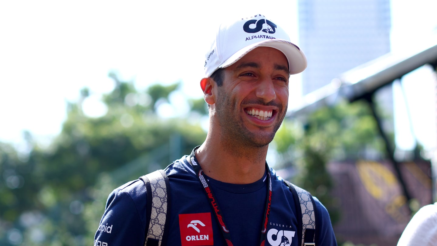 SINGAPORE, SINGAPORE - SEPTEMBER 15: Daniel Ricciardo of Australia and Scuderia AlphaTauri walks in