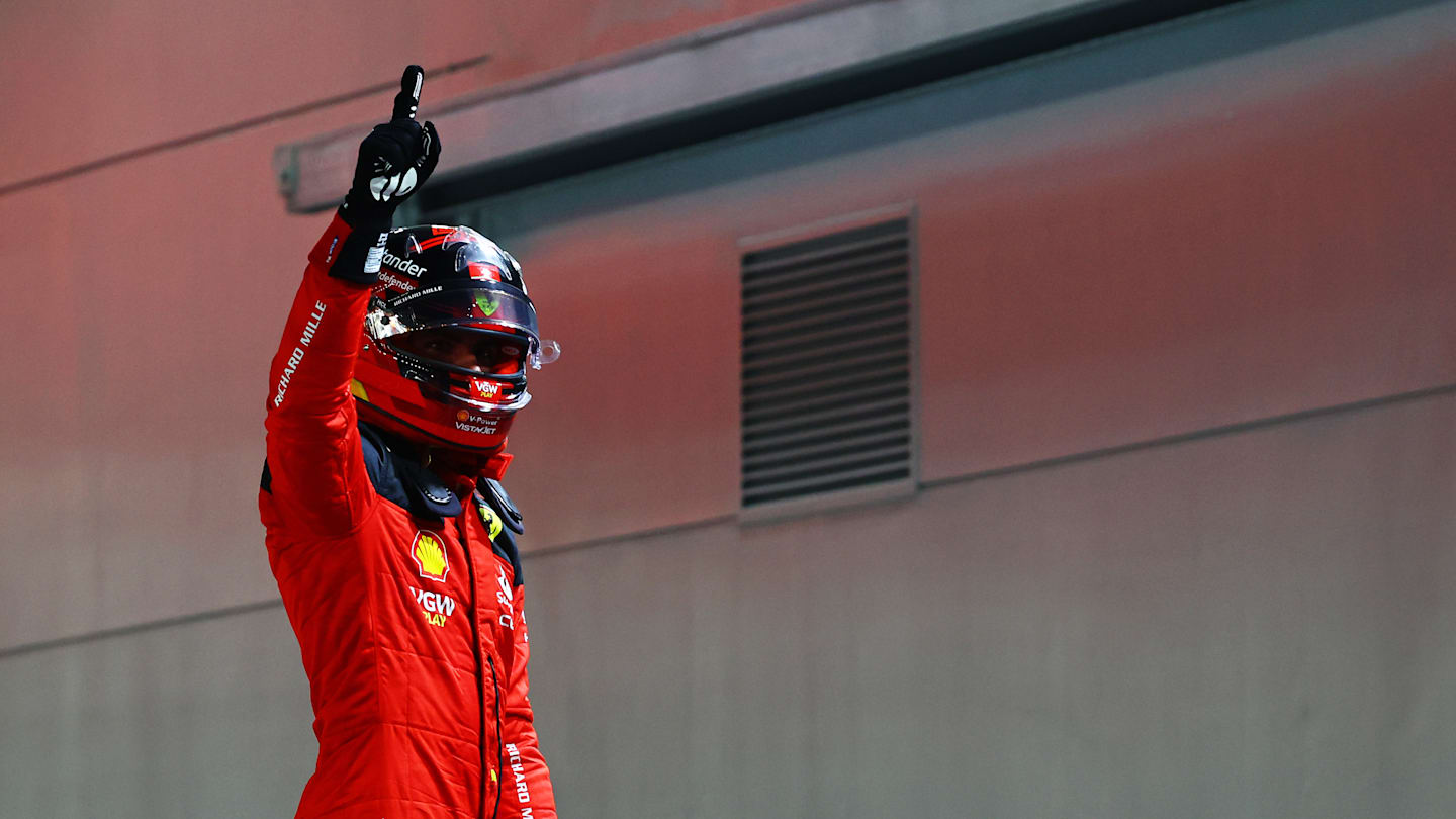 SINGAPORE, SINGAPORE - SEPTEMBER 16: Pole position qualifier Carlos Sainz of Spain and Ferrari