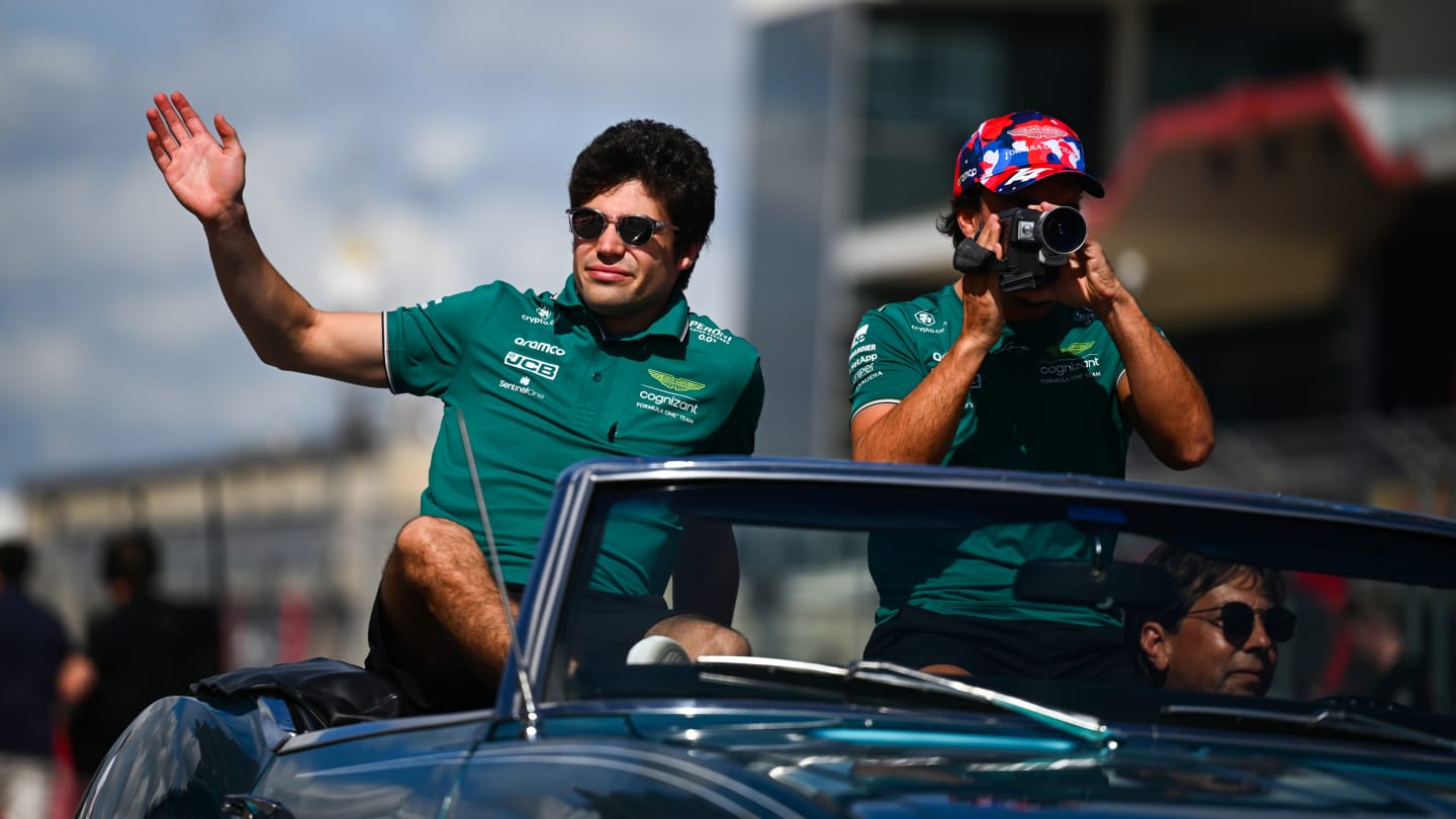 AUSTIN, TEXAS - OCTOBER 22: Lance Stroll of Canada and Aston Martin F1 Team and Fernando Alonso of