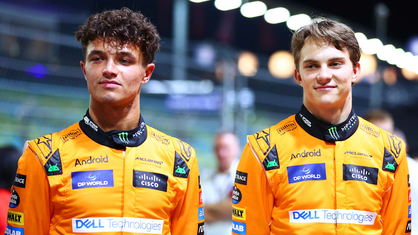 SINGAPORE, SINGAPORE - SEPTEMBER 19: Lando Norris of Great Britain and McLaren and Oscar Piastri of