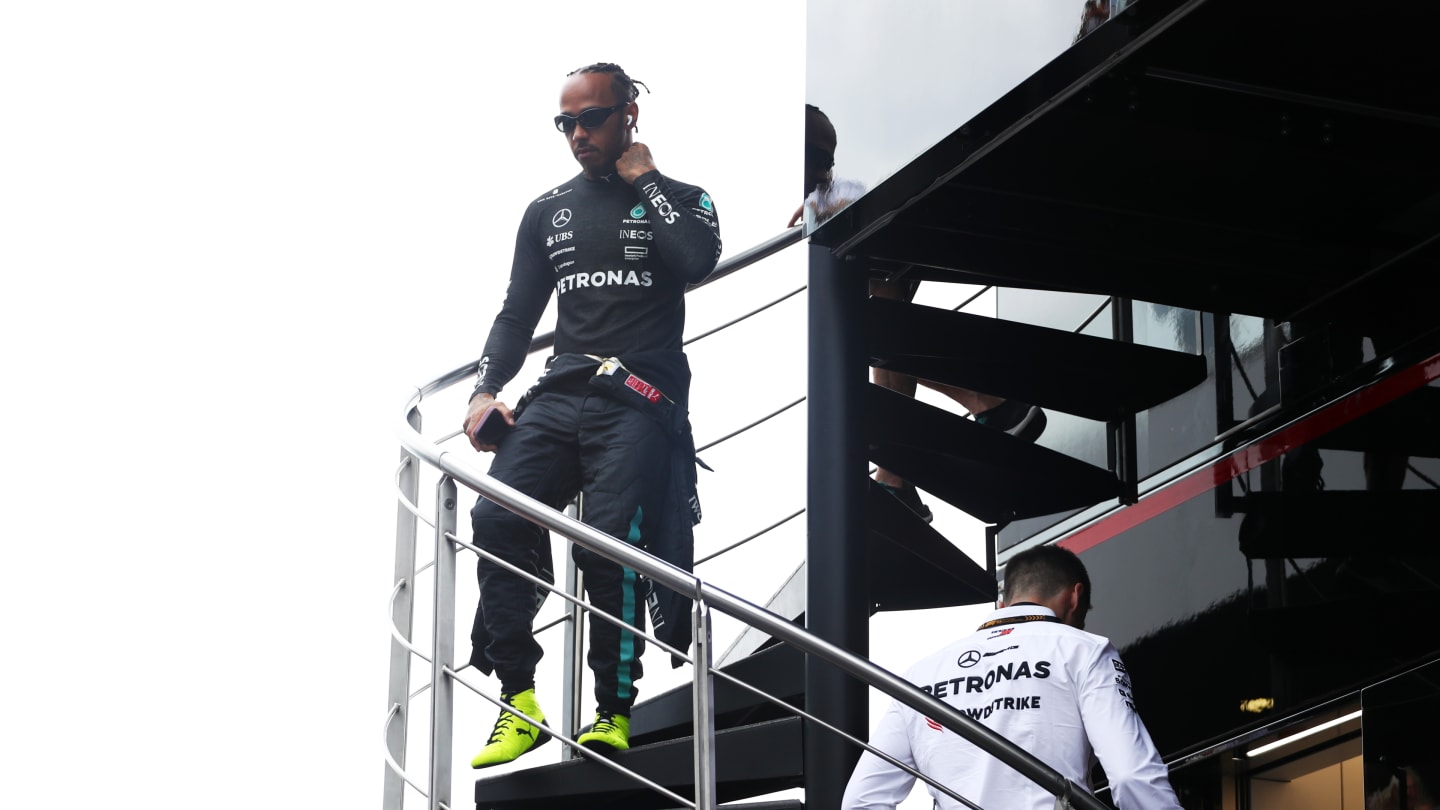 SPIELBERG, AUSTRIA - JUNE 28: Lewis Hamilton of Great Britain and Mercedes walks in the Paddock