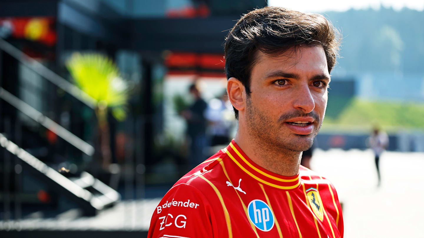 SPIELBERG, AUSTRIA - JUNE 29: Carlos Sainz of Spain and Ferrari walks in the Paddock prior to the