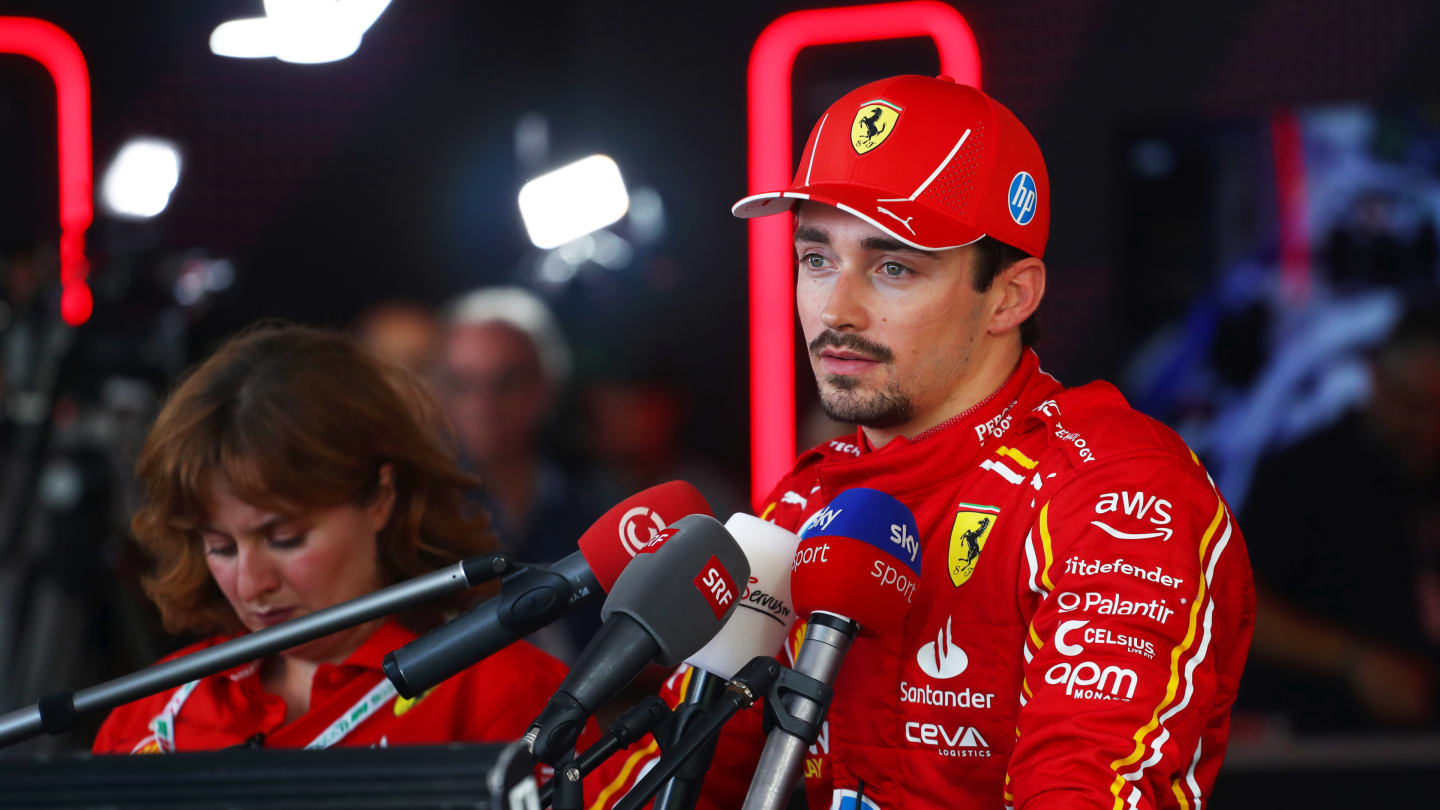 SPIELBERG, AUSTRIA - JUNE 29: 6th placed qualifier Charles Leclerc of Monaco and Ferrari talks to