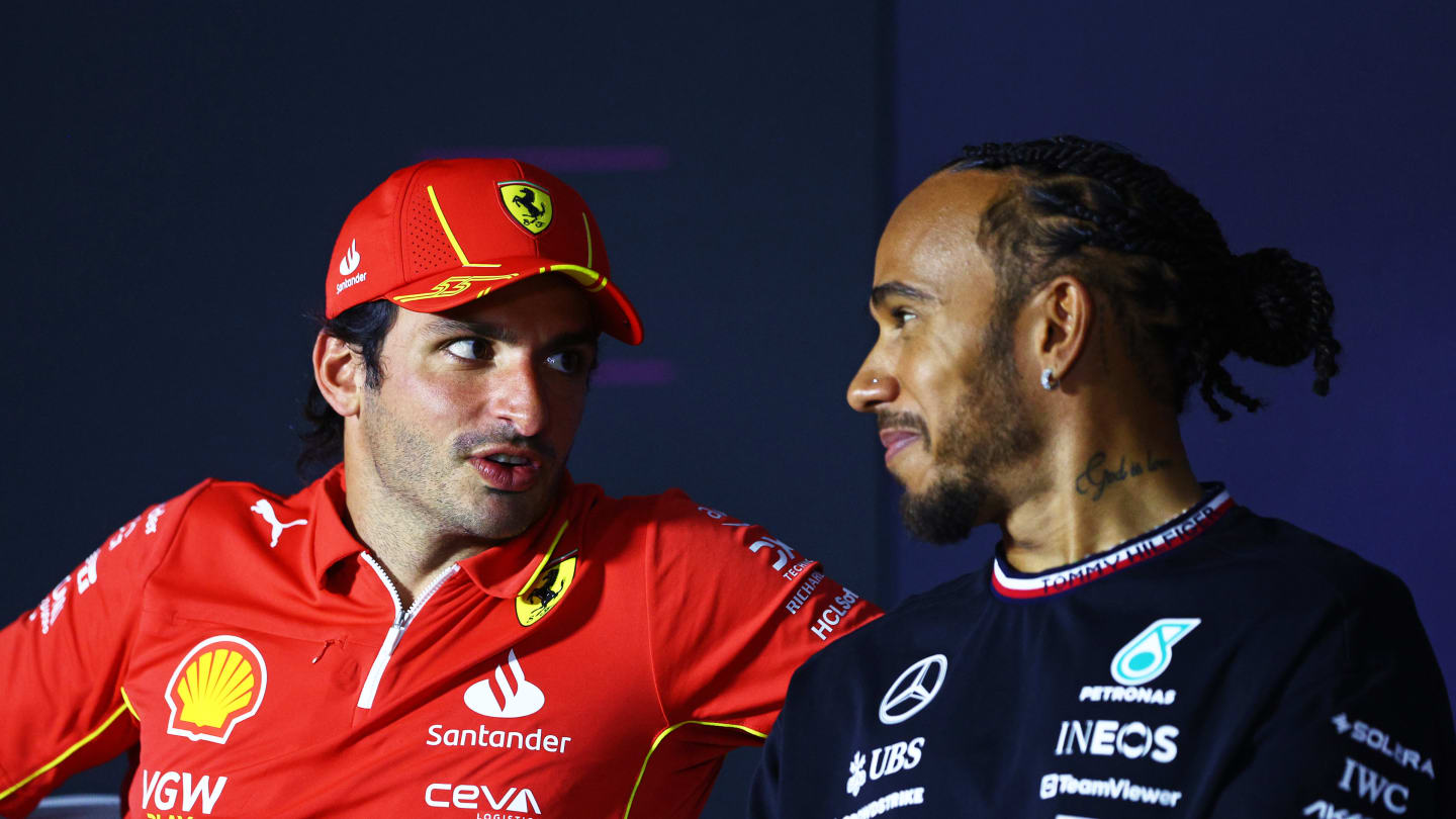 BAHRAIN, BAHRAIN - FEBRUARY 28: Carlos Sainz of Spain and Ferrari and Lewis Hamilton of Great