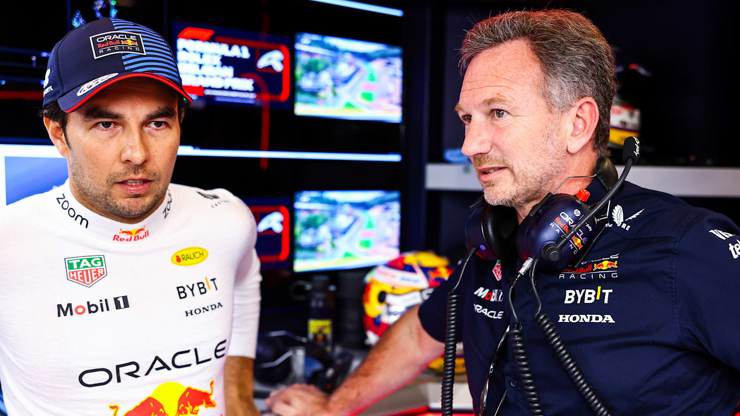 SPA, BELGIUM - JULY 28: Sergio Perez of Mexico and Oracle Red Bull Racing talks to Oracle Red Bull