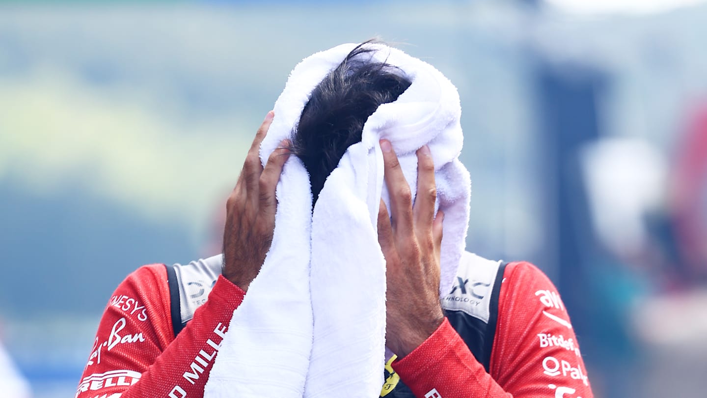 SPA, BELGIUM - JULY 28: Carlos Sainz of Spain and Ferrari walks to the grid prior to the F1 Grand