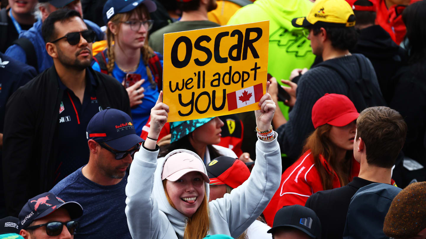 MONTREAL, QUEBEC - JUNE 09: An Oscar Piastri of Australia and McLaren fan holds a sign to show