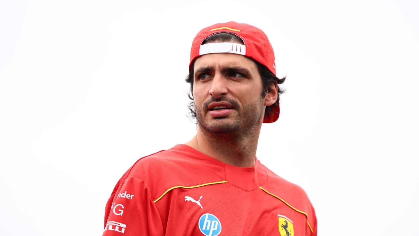 MONTREAL, QUEBEC - JUNE 06: Carlos Sainz of Spain and Ferrari walks in the Paddock during previews