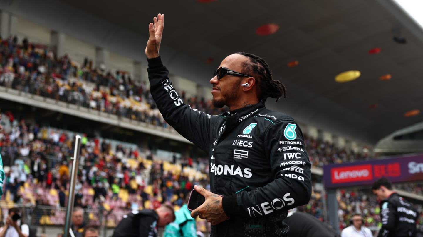 SHANGHAI, CHINA - APRIL 20: Lewis Hamilton of Great Britain and Mercedes waves to fans on the grid
