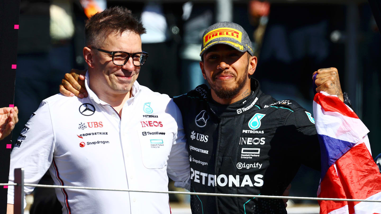 NORTHAMPTON, ENGLAND - JULY 07: Race winner Lewis Hamilton of Great Britain and Mercedes celebrates with race engineer Peter Bonnington on the podium during the F1 Grand Prix of Great Britain. (Photo by Mark Thompson/Getty Images)