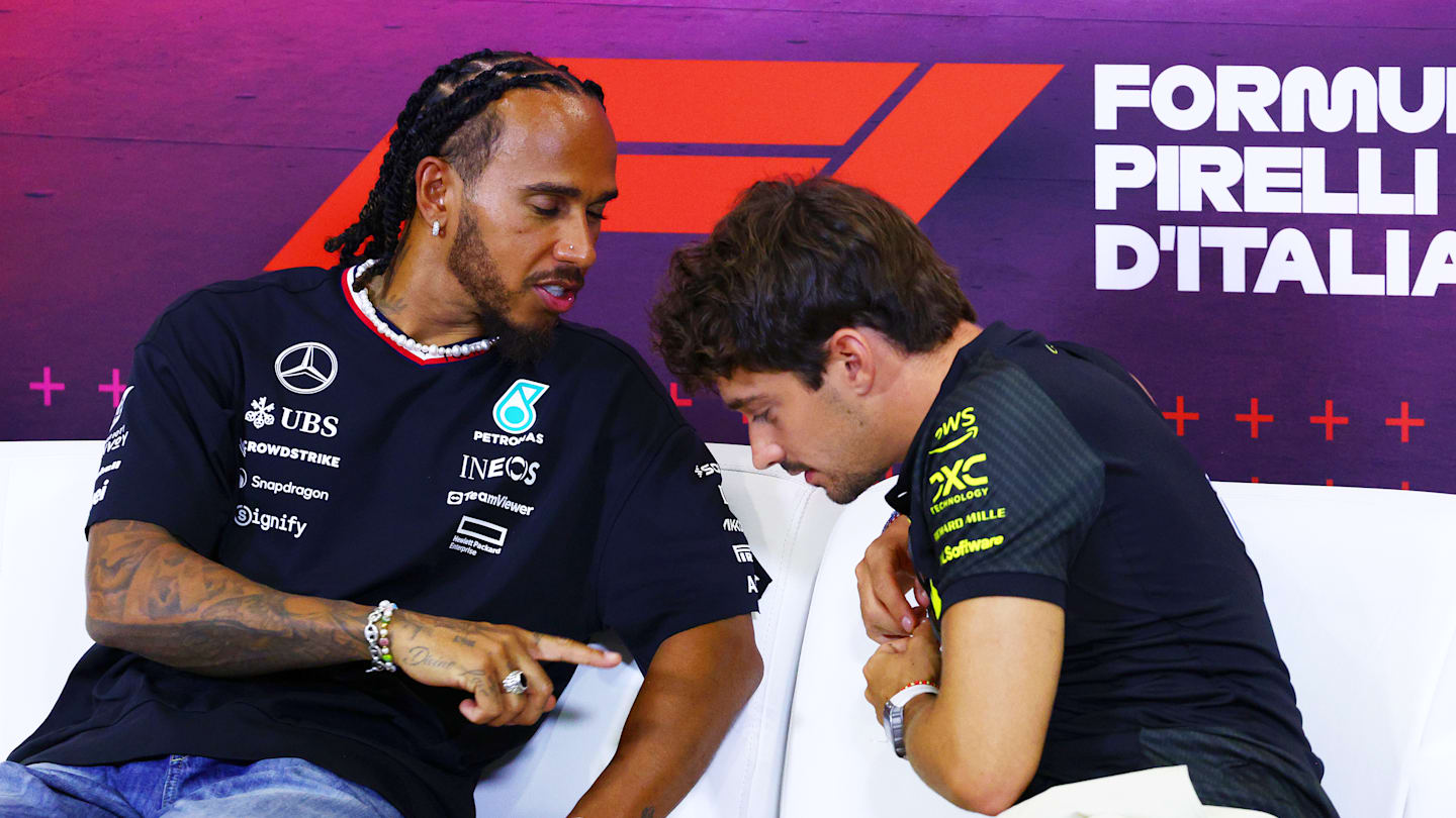 MONZA, ITALY - AUGUST 29: Lewis Hamilton of Great Britain and Mercedes and Charles Leclerc of