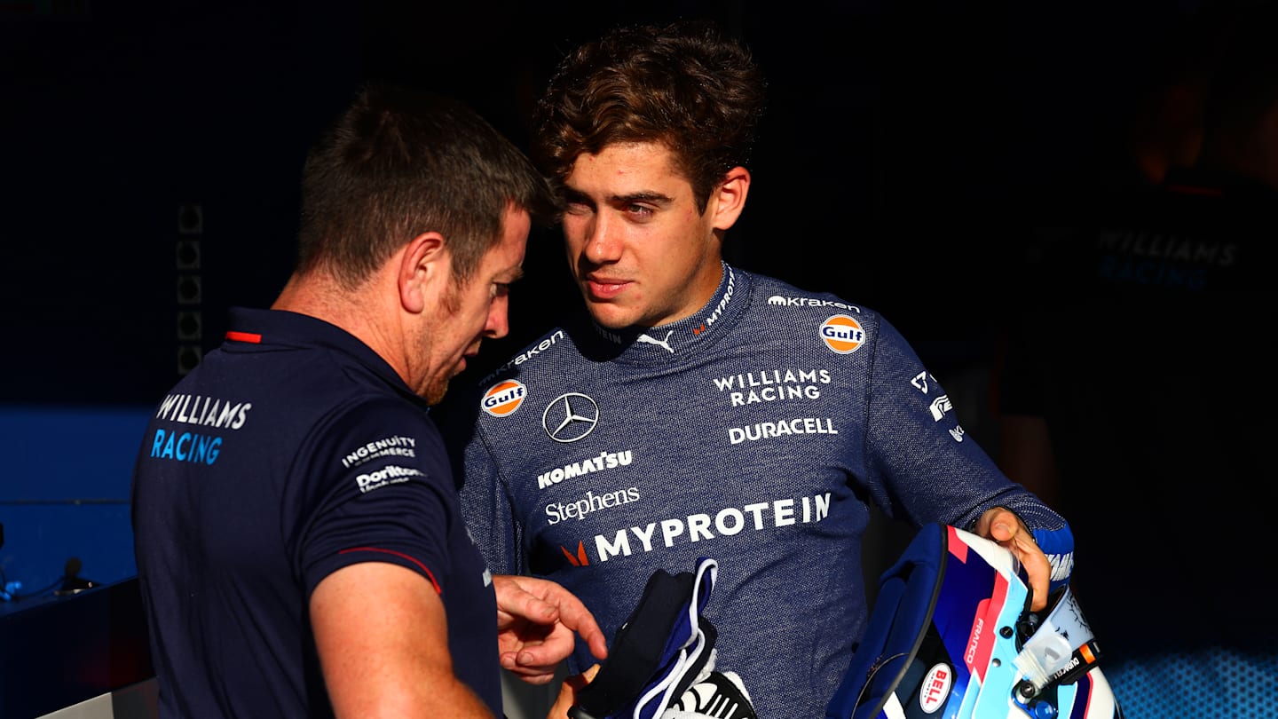 MONZA, ITALY - AUGUST 29: Franco Colapinto of Argentina and Williams talks with a Williams team