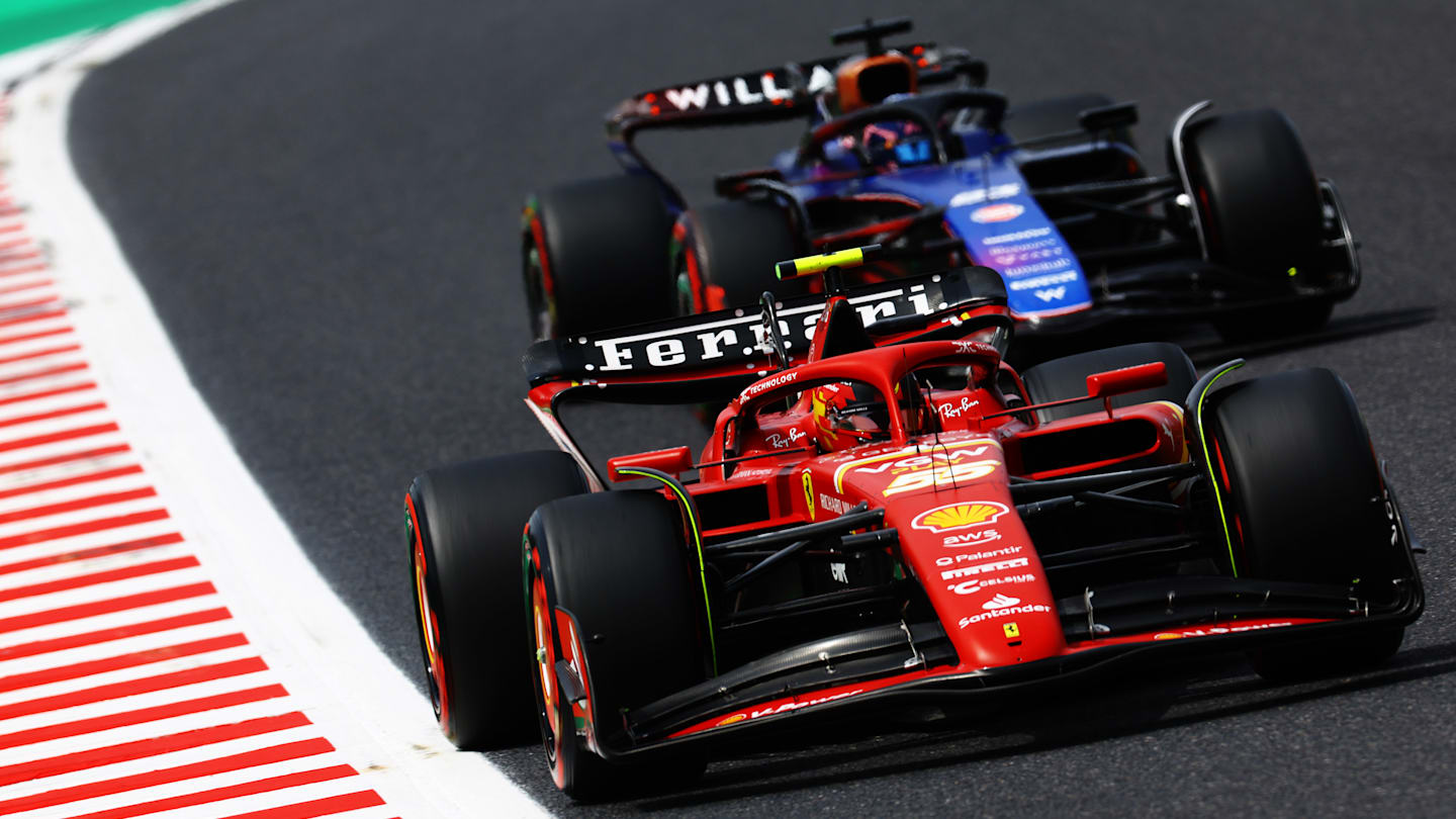 SUZUKA, JAPAN - APRIL 06: Carlos Sainz of Spain driving (55) the Ferrari SF-24 and Alexander Albon