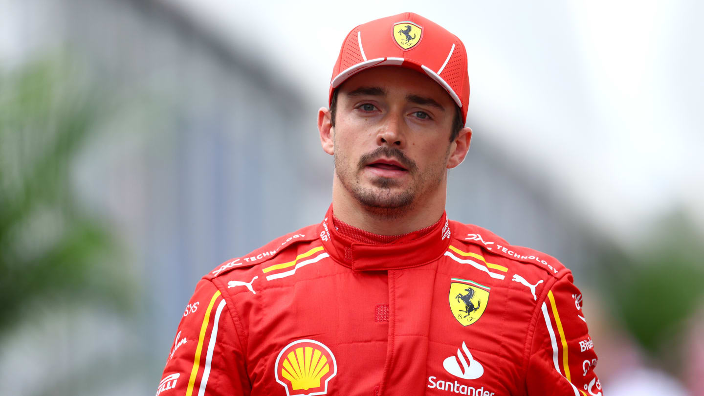 SUZUKA, JAPAN - APRIL 06: 8th placed qualifier Charles Leclerc of Monaco and Ferrari walks in parc