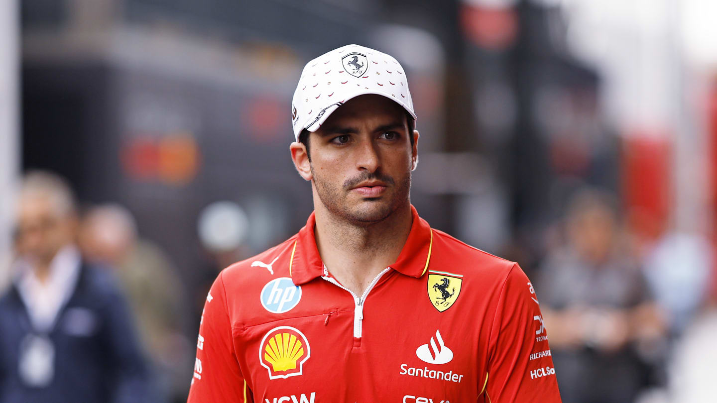 BARCELONA, SPAIN - JUNE 20: Carlos Sainz of Spain and Ferrari walks in the Paddock during previews