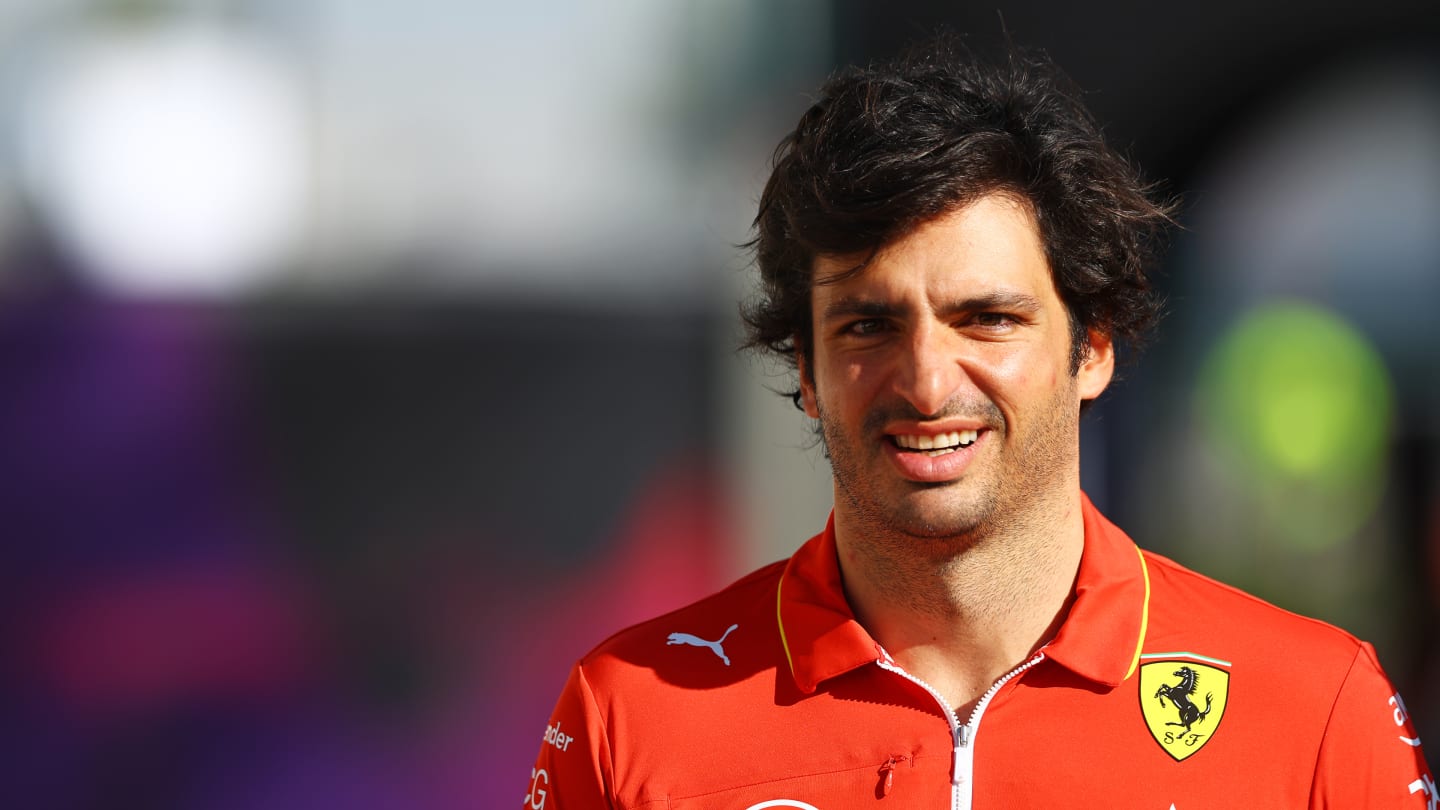 BAHRAIN, BAHRAIN - FEBRUARY 21: Carlos Sainz of Spain and Ferrari walks in the Paddock during day