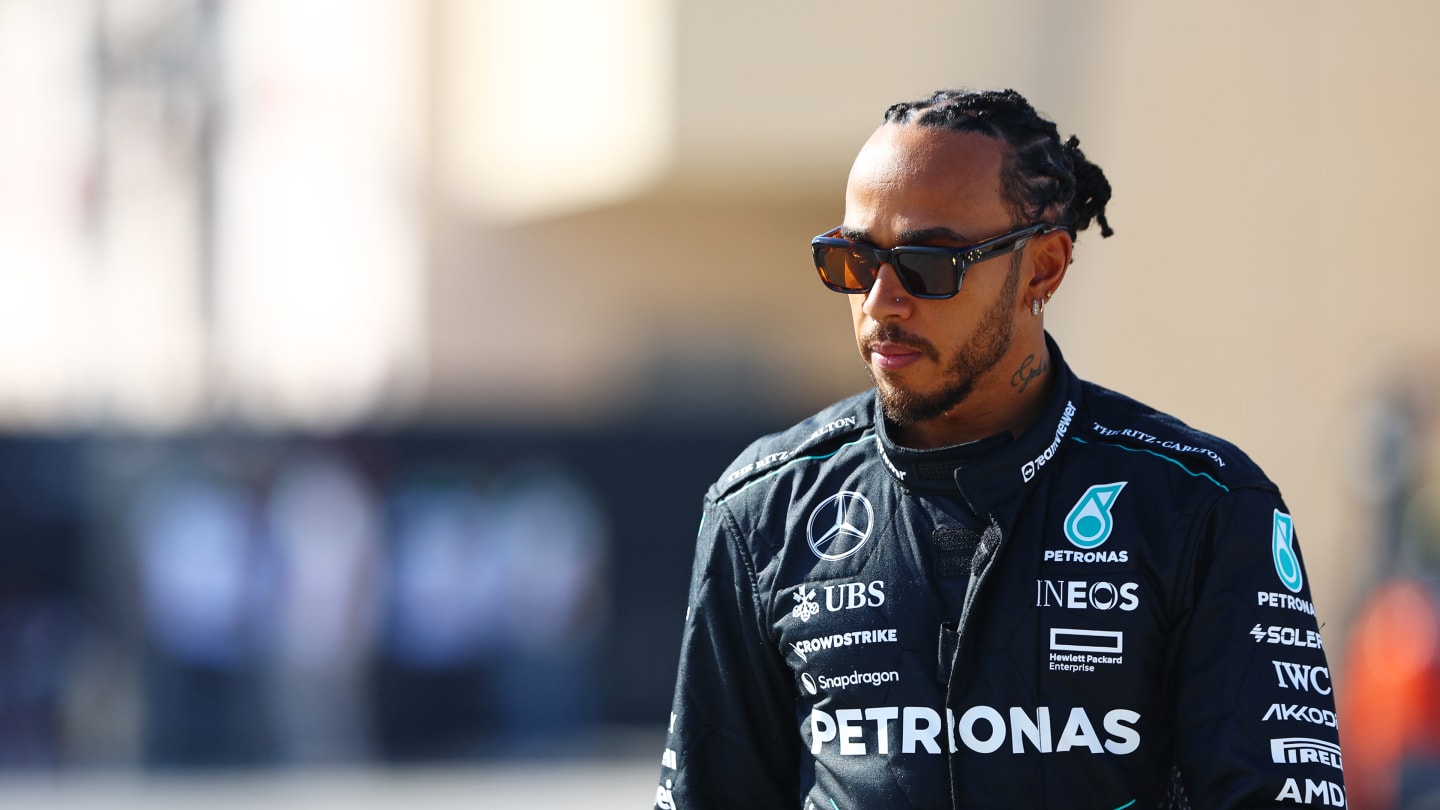 BAHRAIN, BAHRAIN - FEBRUARY 21: Lewis Hamilton of Great Britain and Mercedes walks in the Paddock