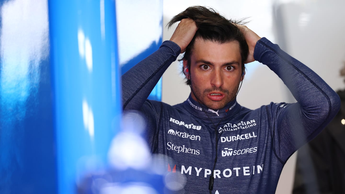 SUZUKA, JAPAN - APRIL 04: Carlos Sainz of Spain and Williams looks on in the garage during practice