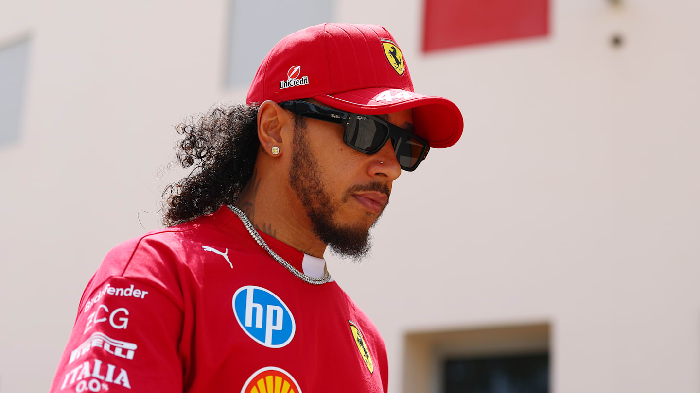 BAHRAIN, BAHRAIN - APRIL 10: Lewis Hamilton of Great Britain and Scuderia Ferrari walks in the