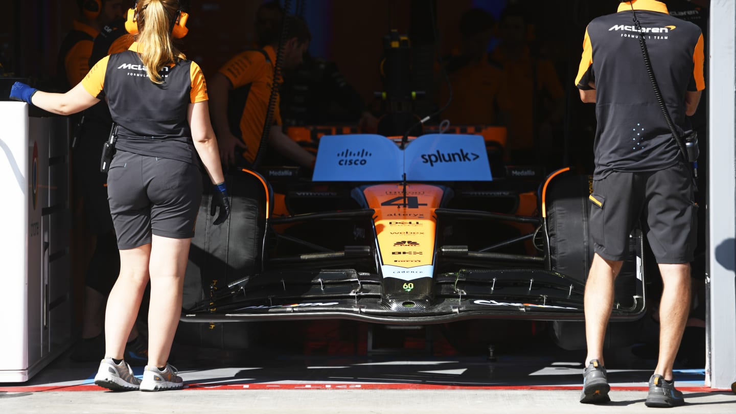BUDAPEST, HUNGARY - JULY 22: McLaren team members look on from their garage during qualifying ahead