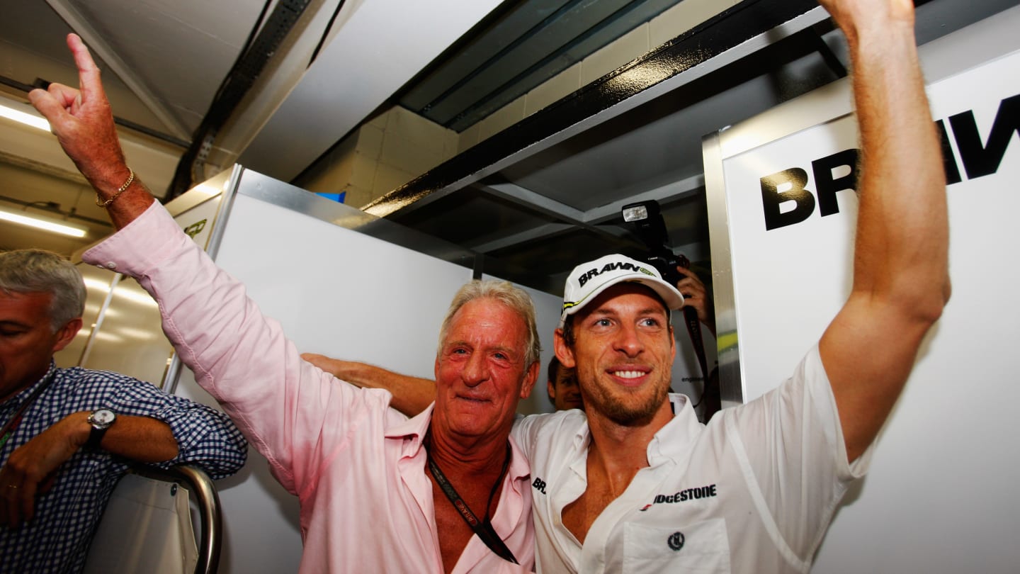 British Brawn Formula One driver Jenson Button in Parc Fermé celebrates winning the drivers' world