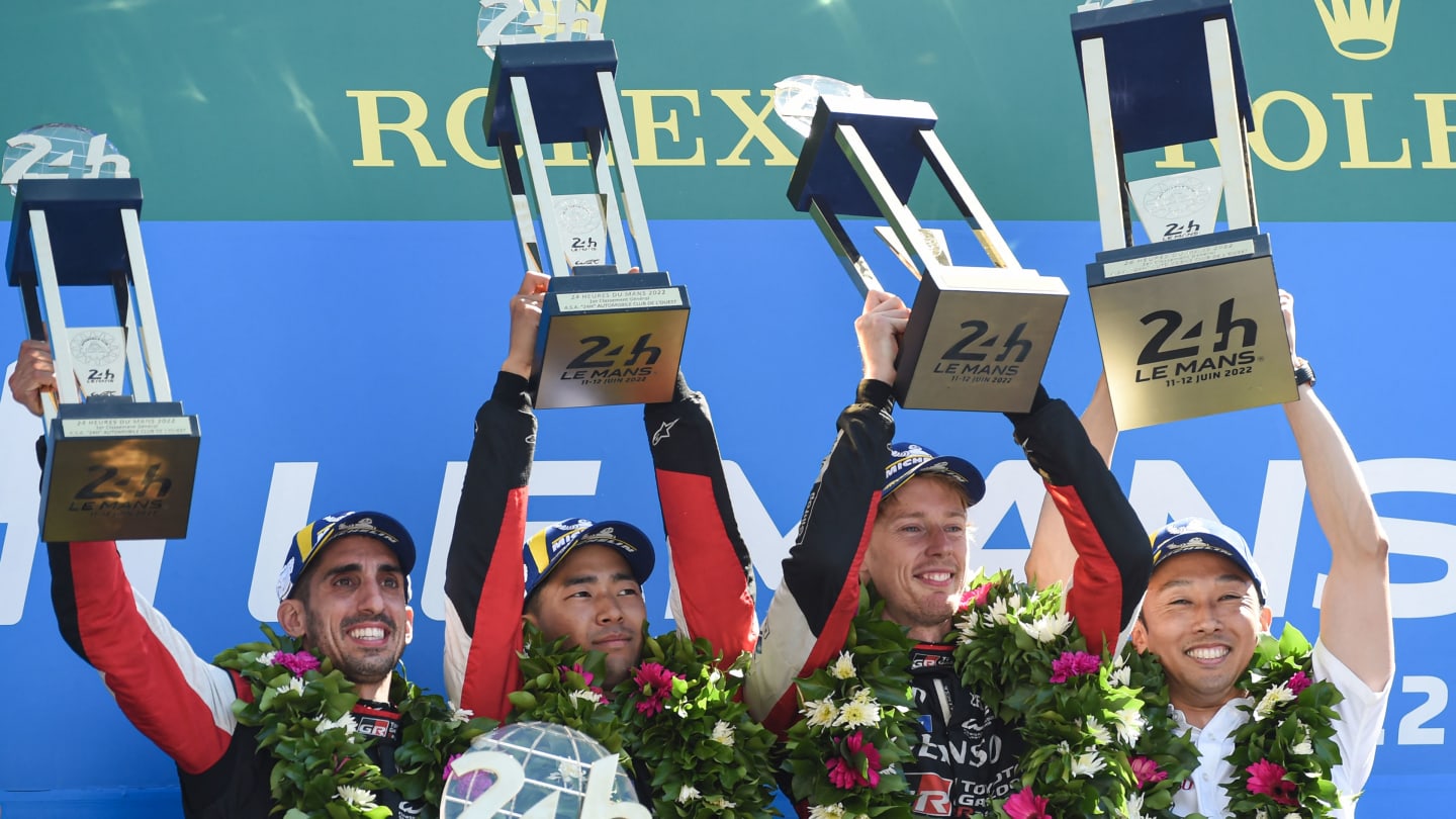 TOPSHOT - (From L) Drivers of Toyota number 8 GR010 Hybrid Hypercar Swiss Sebastien Buemi, Japanese