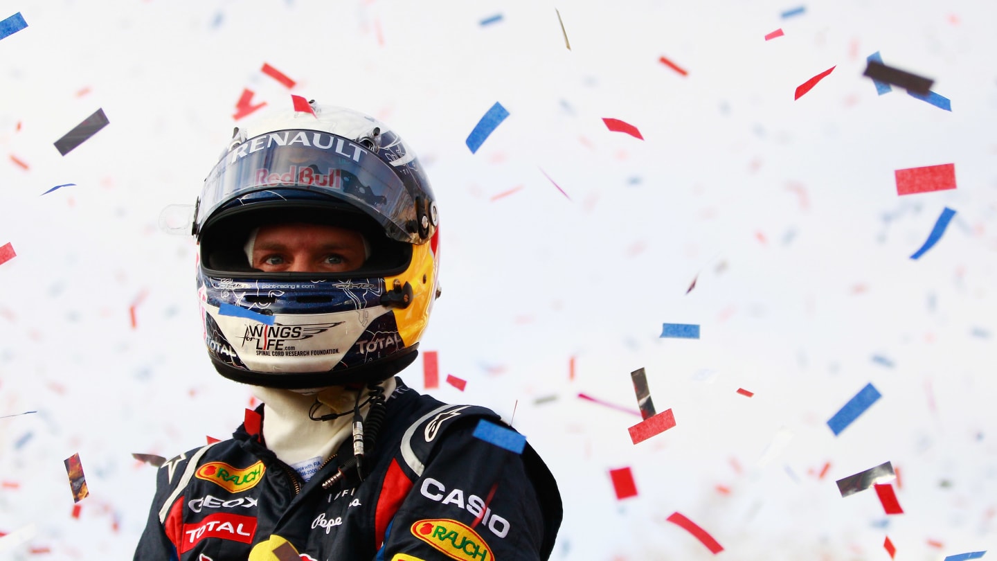 MILTON KEYNES, ENGLAND - DECEMBER 10:  Sebastian Vettel of Germany and Red Bull Racing acknowledges