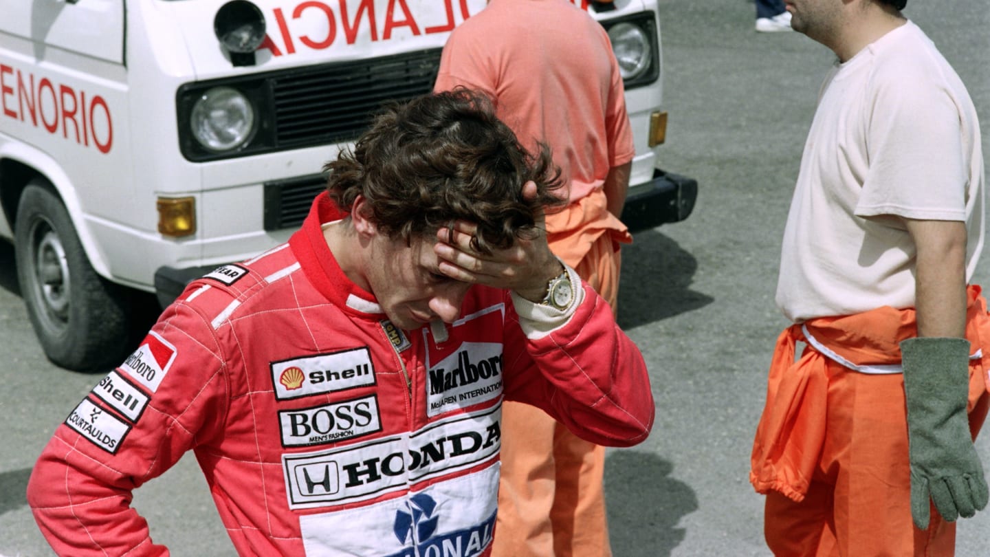 Brazilian driver Ayrton Senna reacts after having seen British driver Martin Donnelly's crash