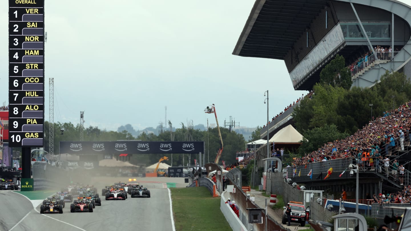 Red Bull's Dutch driver Max Verstappen (L) and Ferrari's Spanish driver Carlos Sainz Jr (2L) lead