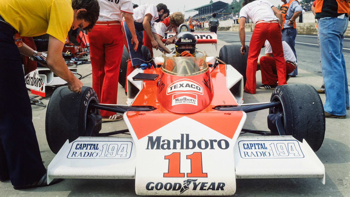 BRANDS HATCH, UNITED KINGDOM - JULY 18: James Hunt waits in his McLaren M23 Ford as a mechanic