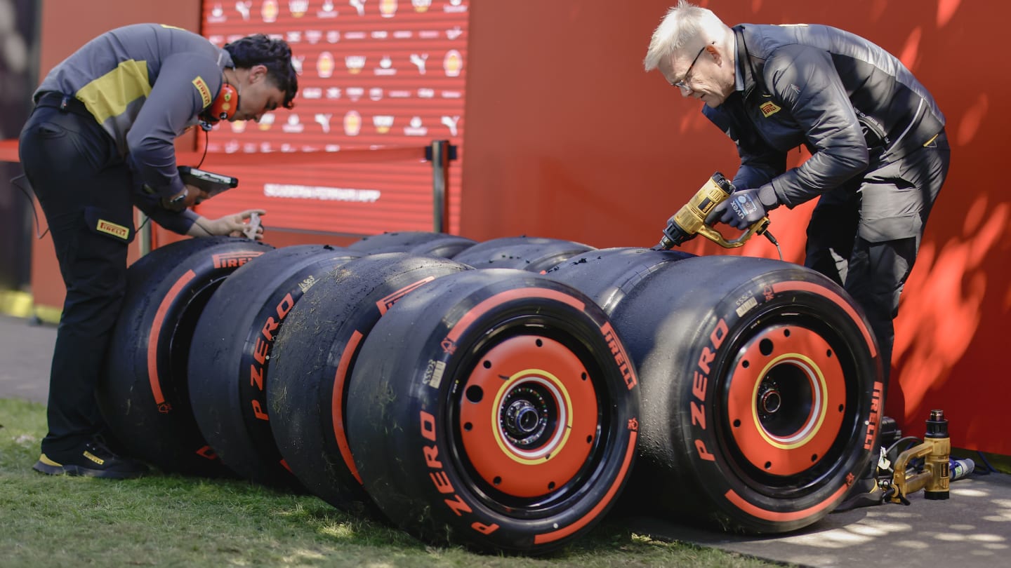 MELBOURNE, AUSTRALIA - MARCH 22: Pirelli team members work on tires during practice ahead of the F1