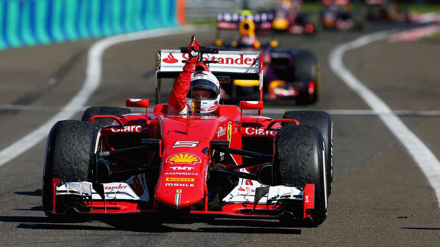 BUDAPEST, HUNGARY - JULY 26:  Sebastian Vettel of Germany and Ferrari celebrates as he approaches