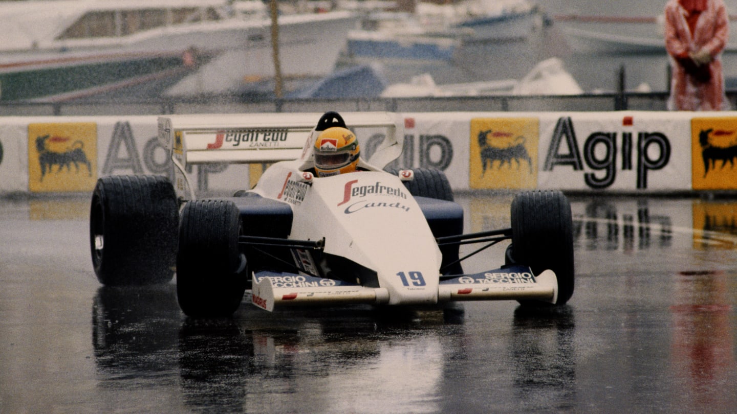 Ayrton Senna of Brazil drives the #19 Toleman-Hart TG184 in the rain to second place during the