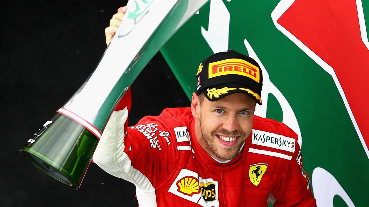 MONTREAL, QC - JUNE 10: Race winner Sebastian Vettel of Germany and Ferrari celebrates on the