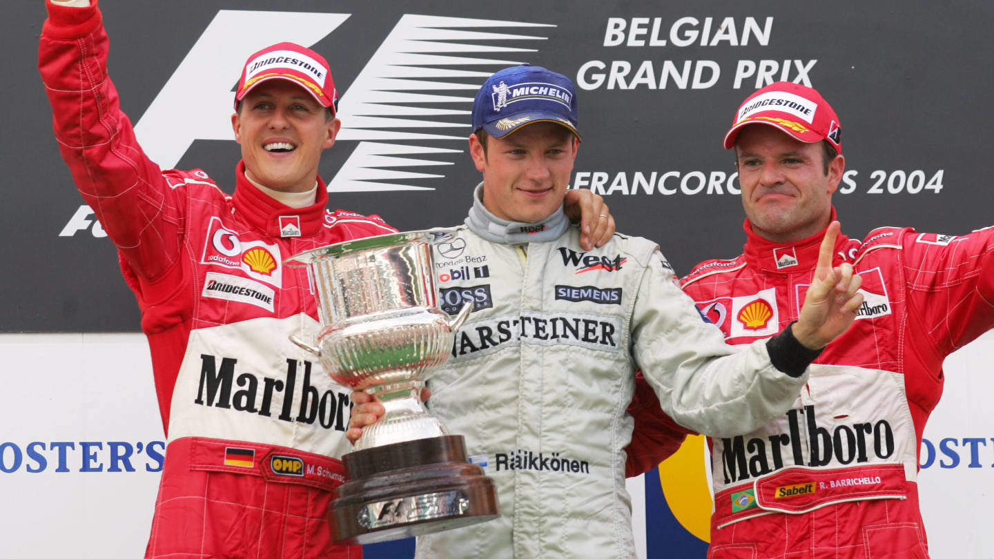 Finnish McLaren-Mercedes driver Kimi Raikkonen (C), German Ferrari driver Michael Schumacher (L)