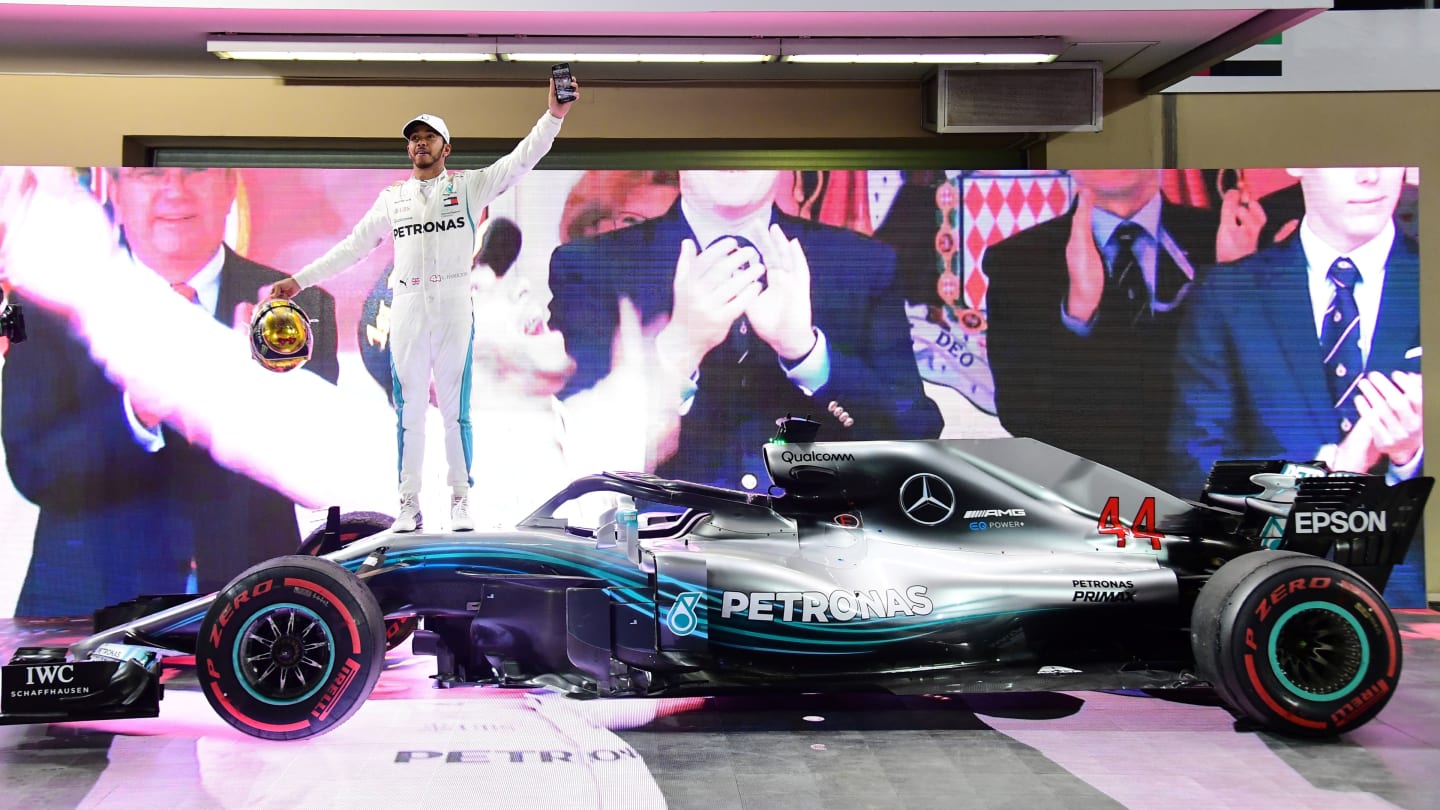 Mercedes' British driver Lewis Hamilton celebrates after winning the Abu Dhabi Formula One Grand