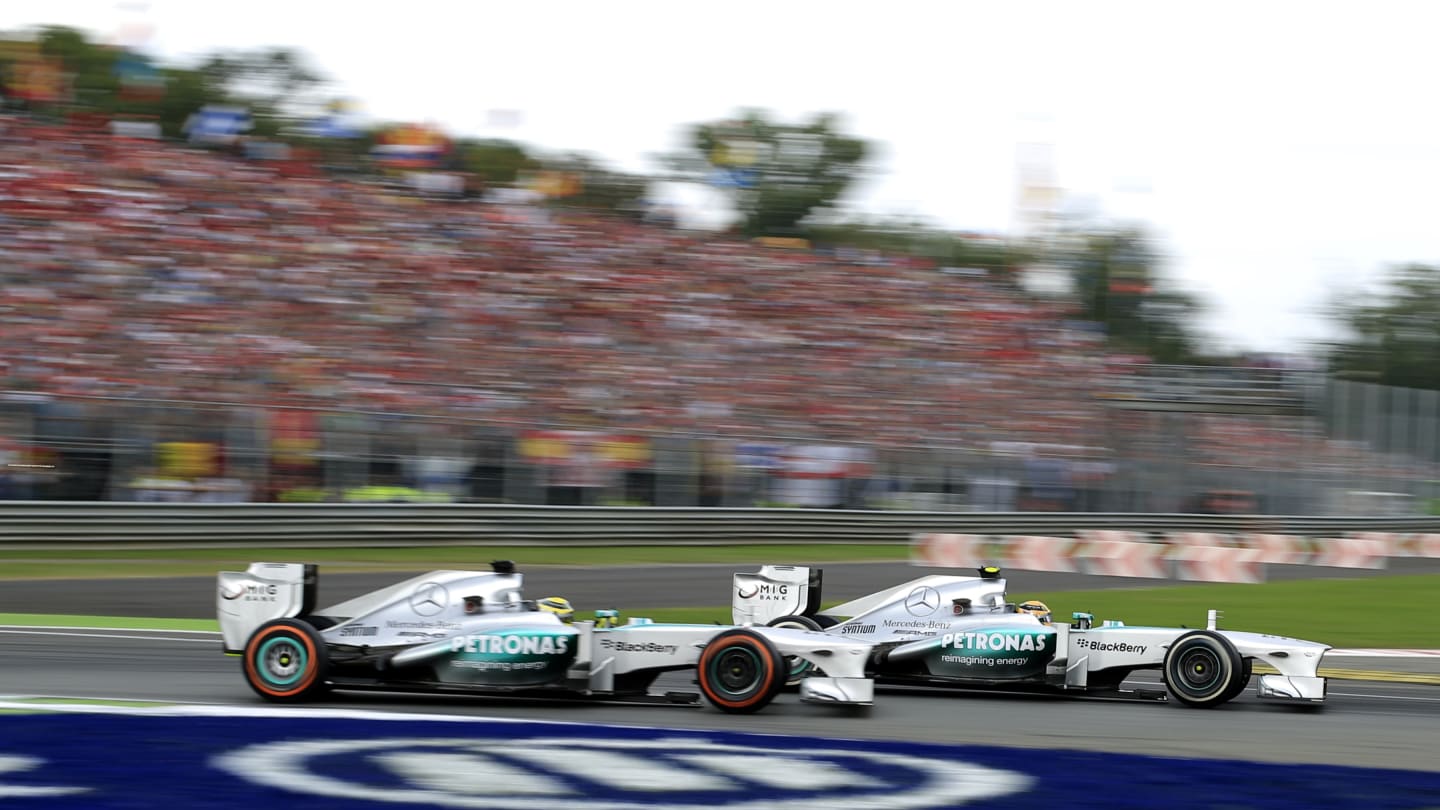 Mercedes'  German driver Nico Rosberg (L) and Mercedes'  British driver Lewis Hamilton  drive at